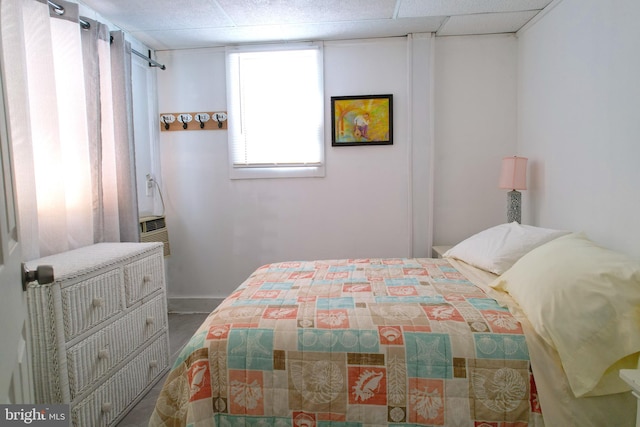 bedroom with a paneled ceiling