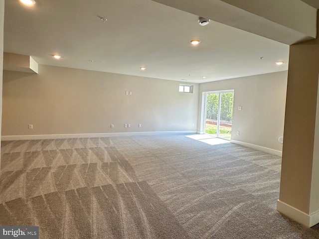 empty room with light carpet, recessed lighting, and baseboards