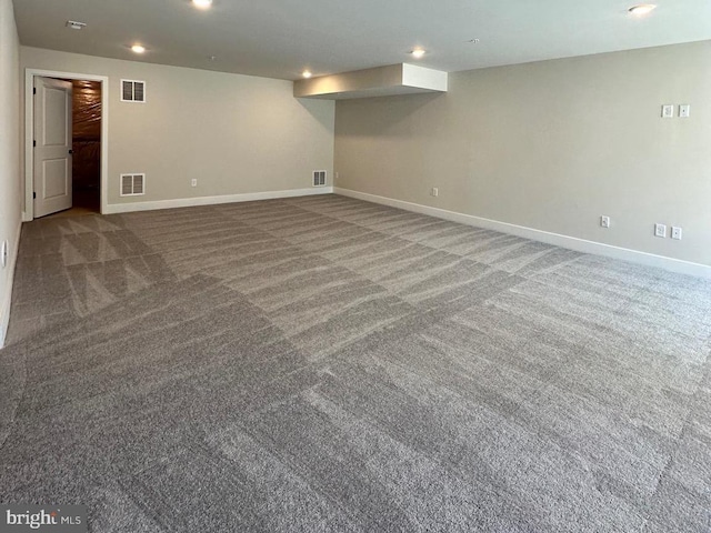 finished basement with baseboards, carpet flooring, visible vents, and recessed lighting