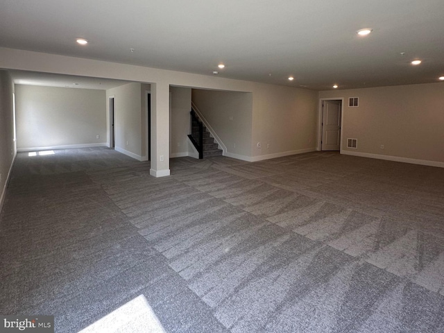 below grade area featuring recessed lighting, carpet flooring, and stairway