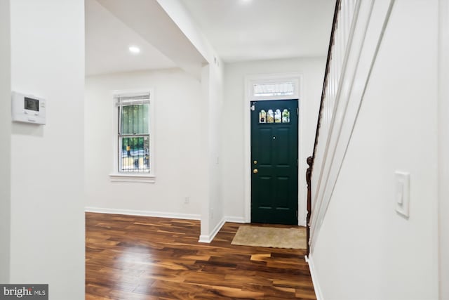 entrance foyer featuring dark wood-style flooring, recessed lighting, and baseboards