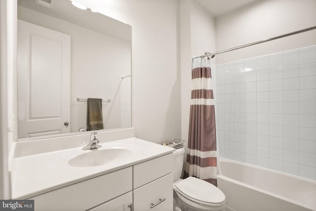 full bathroom with toilet, vanity, and shower / tub combo