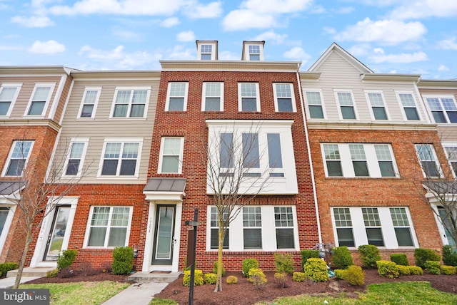 multi unit property featuring brick siding