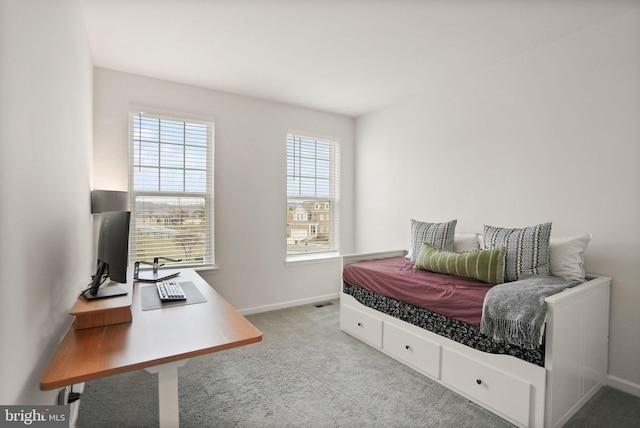 bedroom with baseboards and carpet floors