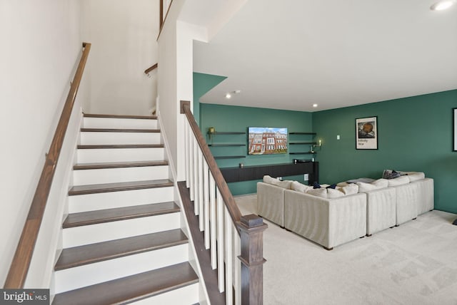 stairway with carpet flooring and recessed lighting