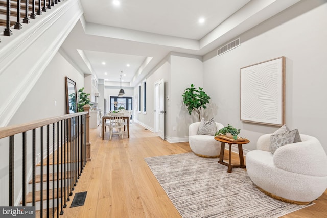 interior space featuring recessed lighting, visible vents, light wood-style flooring, and baseboards