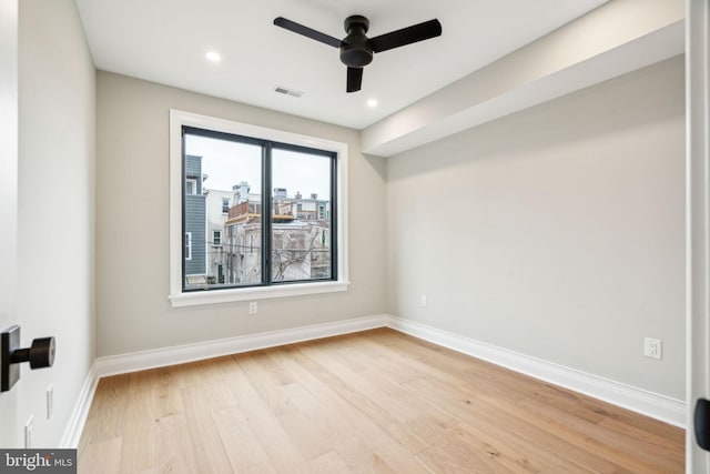 unfurnished room with recessed lighting, visible vents, light wood-style floors, ceiling fan, and baseboards