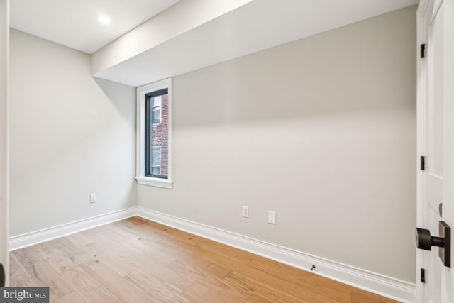 interior space featuring light wood-style floors and baseboards