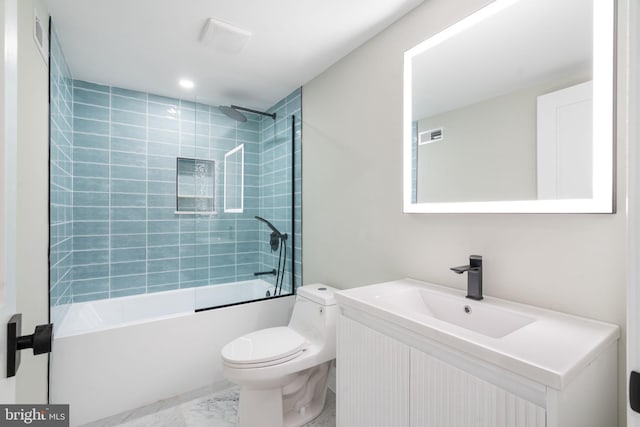 bathroom with visible vents, toilet, marble finish floor, tub / shower combination, and vanity