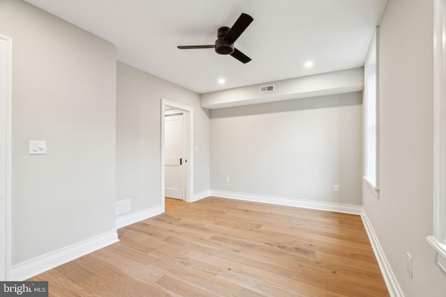 unfurnished room with baseboards, visible vents, a ceiling fan, light wood-type flooring, and recessed lighting