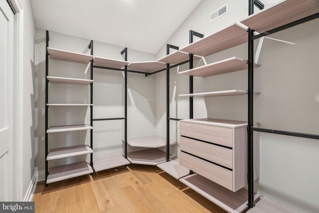 spacious closet with visible vents and light wood-style flooring