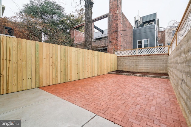 view of patio / terrace featuring fence