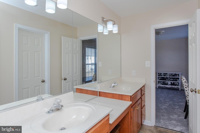 full bath with double vanity and a sink