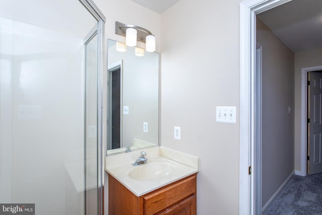 bathroom featuring vanity and baseboards