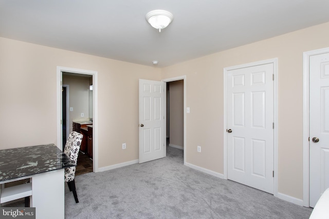 unfurnished bedroom with carpet and baseboards