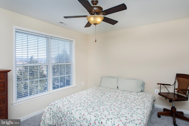 bedroom with a ceiling fan, carpet, visible vents, and baseboards