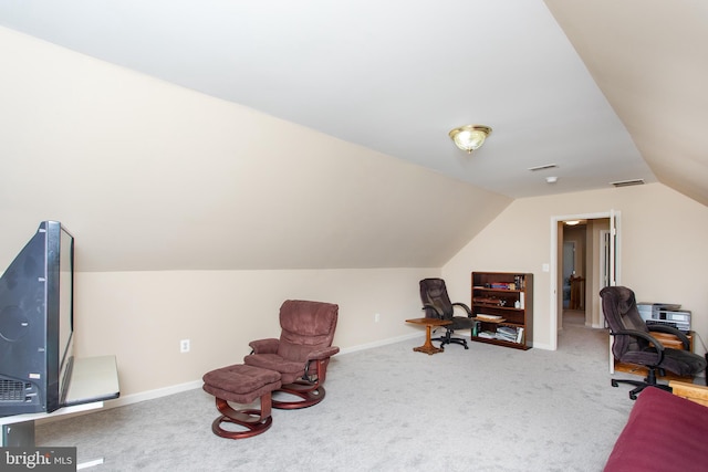 living area with carpet, visible vents, lofted ceiling, and baseboards