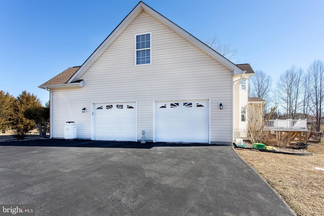 view of home's exterior featuring aphalt driveway