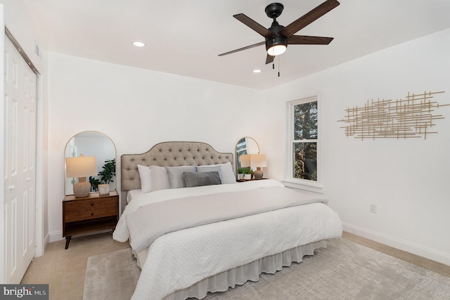 bedroom featuring recessed lighting, a closet, carpet flooring, and baseboards