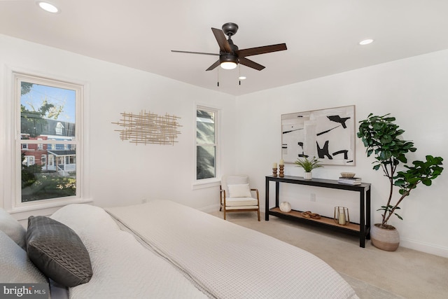 carpeted bedroom featuring baseboards, a ceiling fan, and recessed lighting