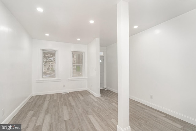 interior space featuring light wood-style floors, baseboards, and recessed lighting