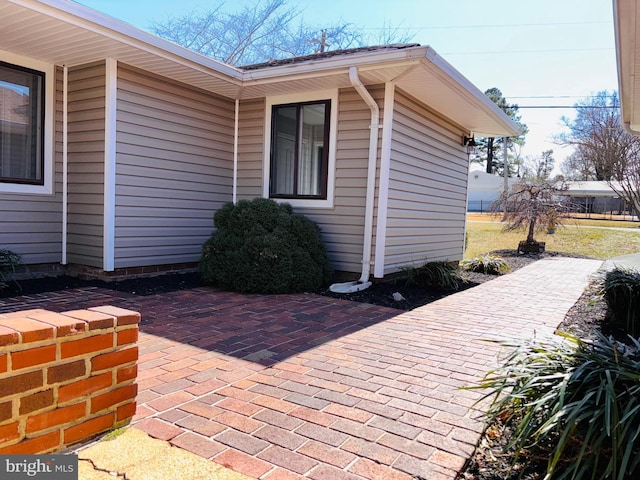 view of property exterior featuring a patio