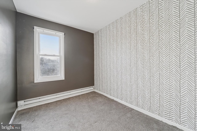 unfurnished room featuring a baseboard radiator, carpet flooring, and baseboards