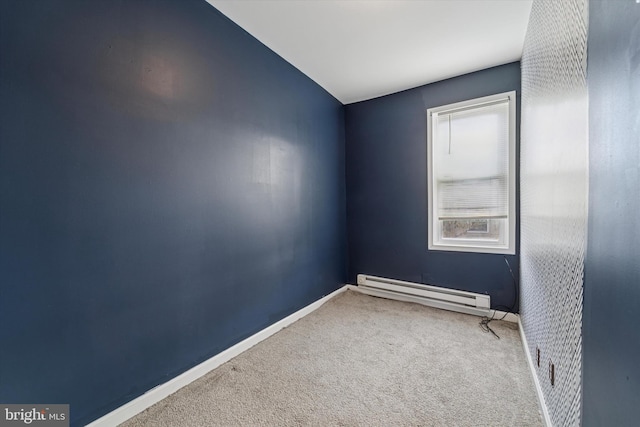 unfurnished room featuring carpet, a baseboard radiator, and baseboards