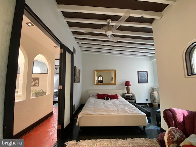 bedroom featuring beamed ceiling, baseboards, and ceiling fan