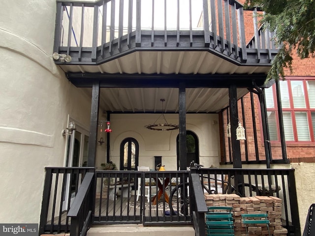 entrance to property with brick siding and stucco siding