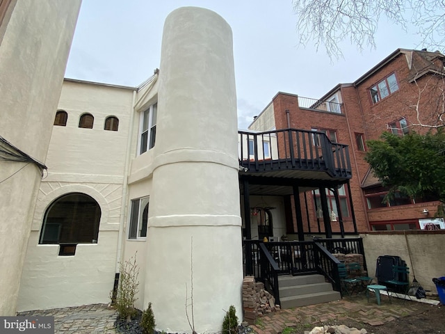 back of house with stucco siding