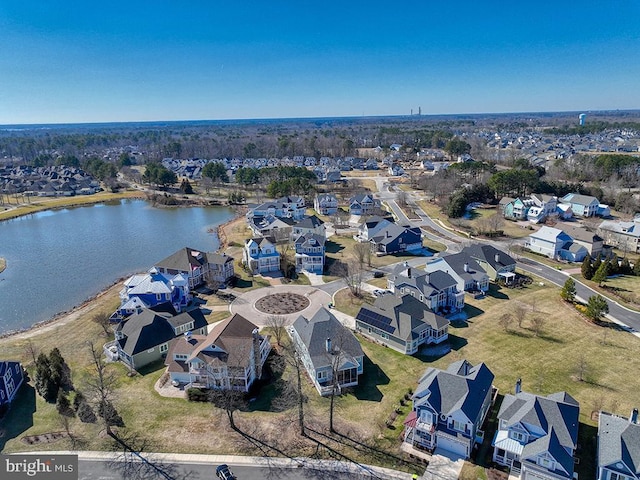 birds eye view of property with a residential view and a water view