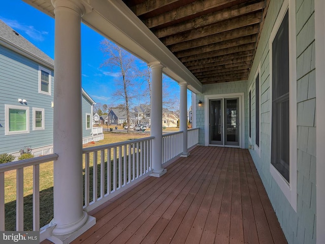 wooden terrace with a residential view