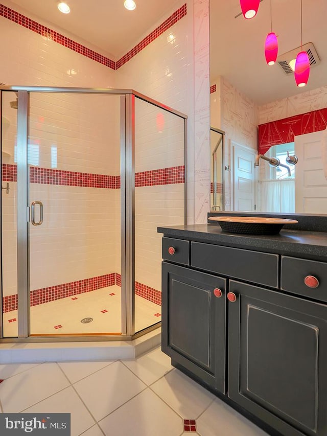 full bath featuring recessed lighting, visible vents, a shower stall, vanity, and tile patterned flooring