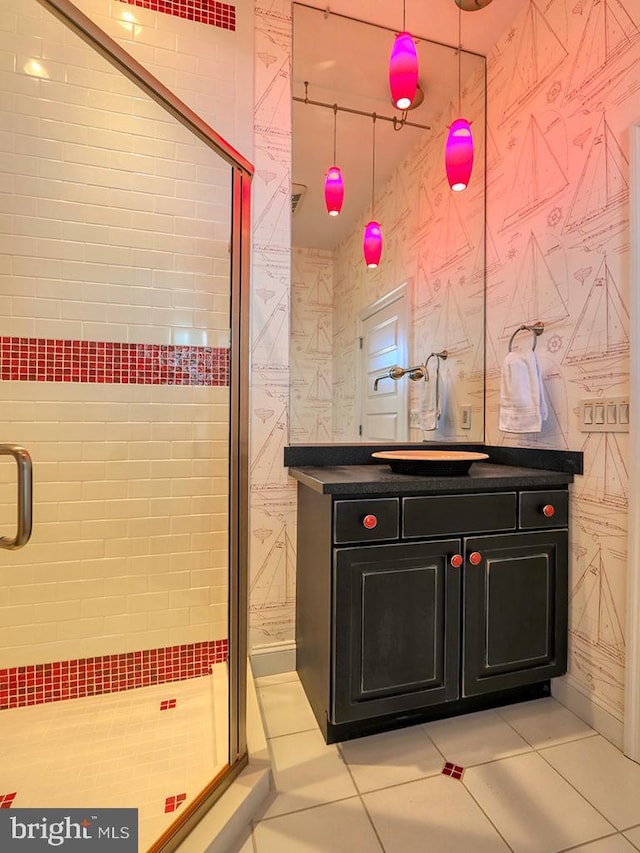 bathroom featuring a stall shower, vanity, and tile patterned floors