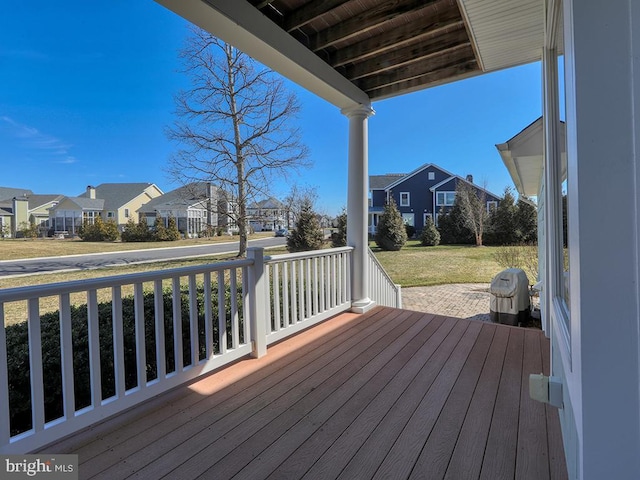 wooden terrace featuring a residential view