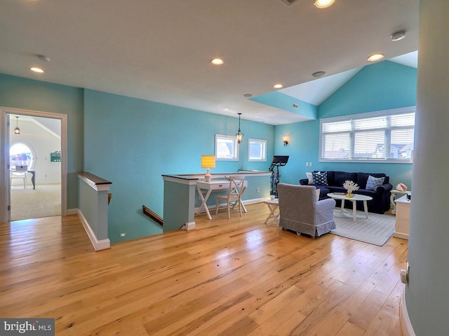 living room with vaulted ceiling, baseboards, hardwood / wood-style flooring, and recessed lighting