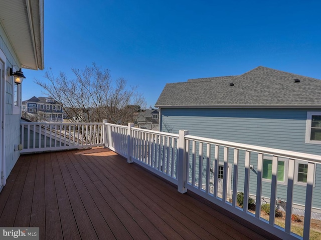 wooden deck featuring a residential view