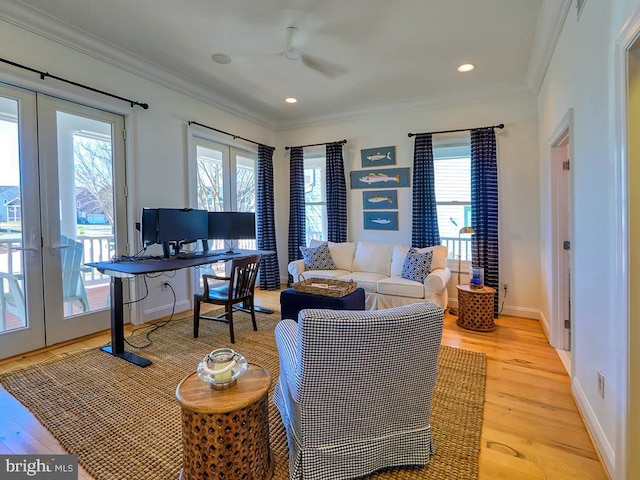 office space with baseboards, french doors, light wood-type flooring, and crown molding