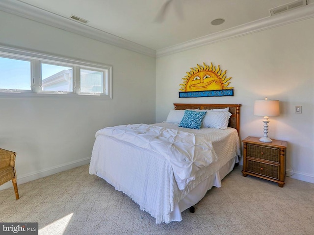 carpeted bedroom featuring baseboards, visible vents, and ornamental molding