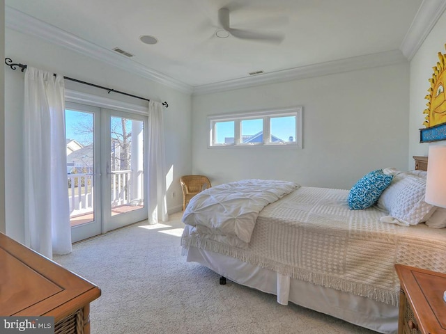 carpeted bedroom featuring access to outside, visible vents, ornamental molding, and french doors