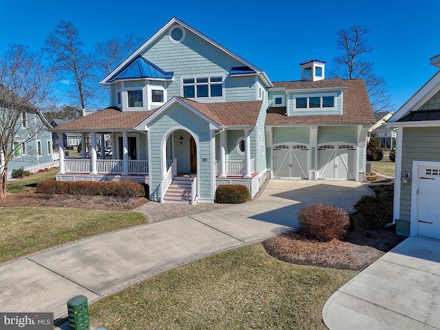 view of front of home featuring concrete driveway, a porch, roof with shingles, and an attached garage