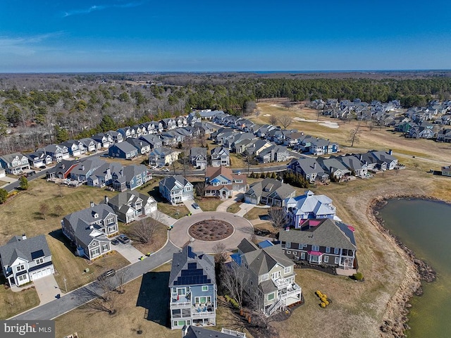 birds eye view of property featuring a water view and a residential view