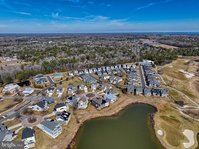 drone / aerial view with a water view and a residential view