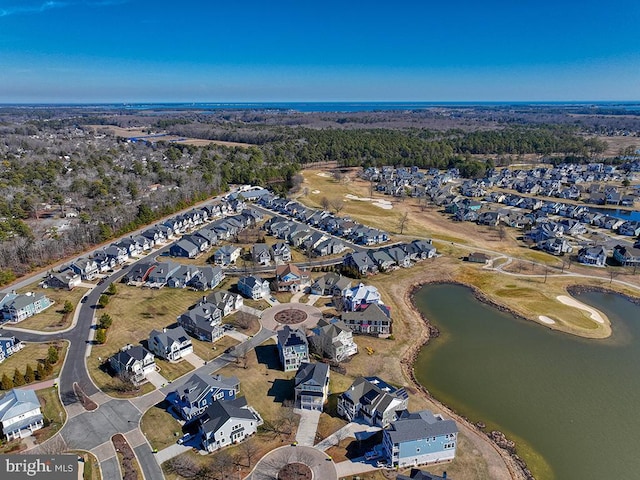 drone / aerial view featuring a water view and a residential view