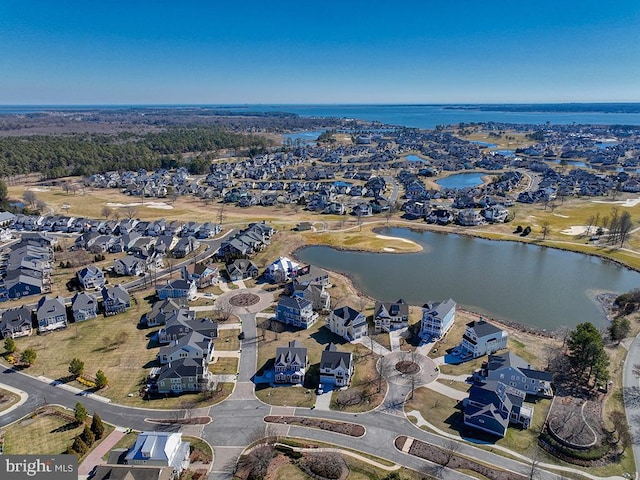 bird's eye view featuring a water view and a residential view