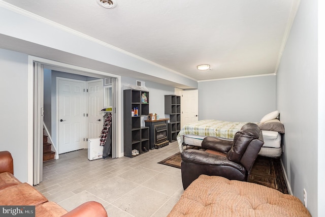 bedroom with visible vents and crown molding