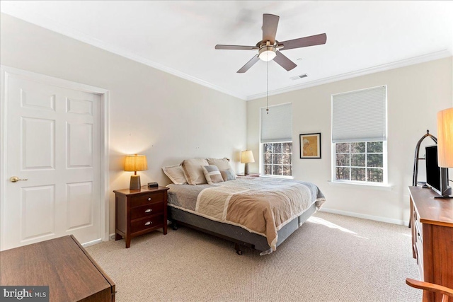 bedroom featuring crown molding, light colored carpet, visible vents, a ceiling fan, and baseboards