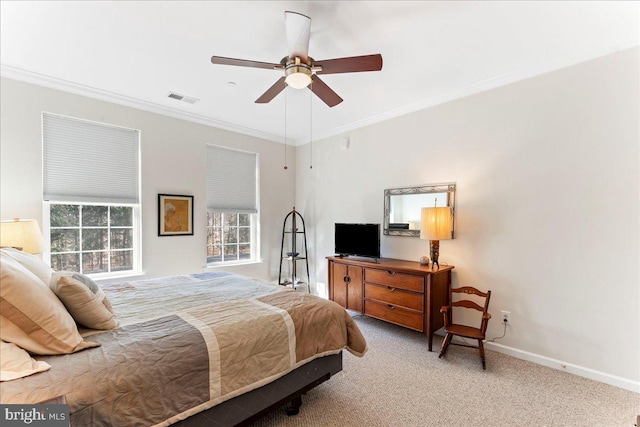 bedroom featuring ornamental molding, carpet, visible vents, and baseboards