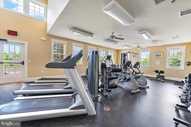 exercise room with visible vents and baseboards